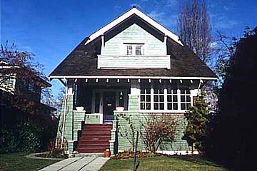 A 1.5 storey bungalow, Vancouver, B.C., Canada (1906-1912) features a semi-enclosed porch, original art glass and wainscotting