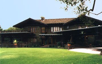 Robert R. Blacker house, 1177 Hillcrest Avenue, 1907. The Blacker house was the largest, most elaborate of the Greenes’ bungalow designs, and is a grand expression of the American Arts and Crafts style and the California bungalow. Situating the home on a corner of the 5.5 acre property allowed for a more natural garden setting reminiscent of the Japanese, and the enormous, timbered porte cochere angled out from the central entry to rest on a clinker brick pillar is a dominate feature that grounds the large two-story shingled house to the surrounding landscape.