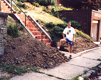 Digging the foundation for the wall. This dirt was carried to the back yard to form the first terrace.